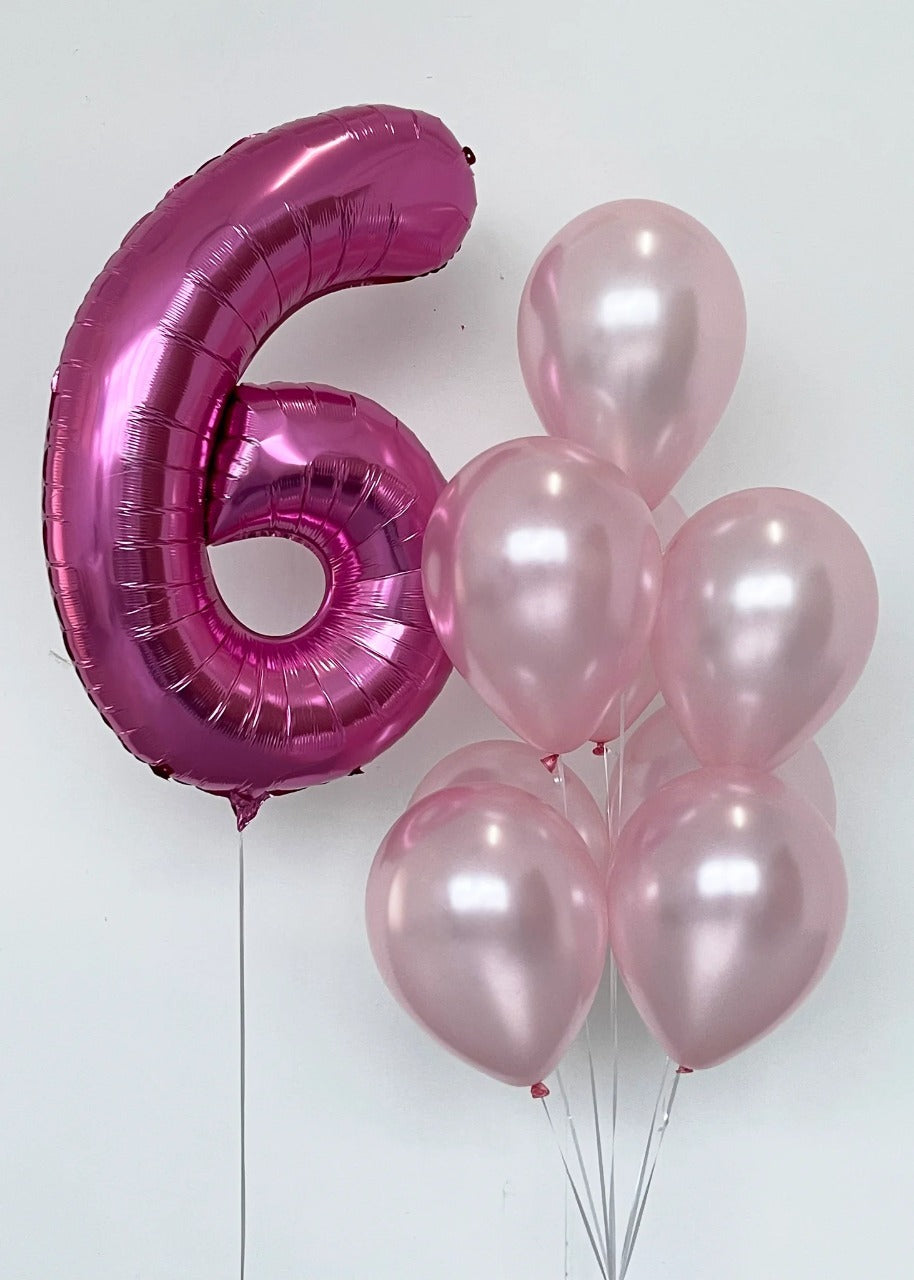 Girl's birthday party balloons with number balloon