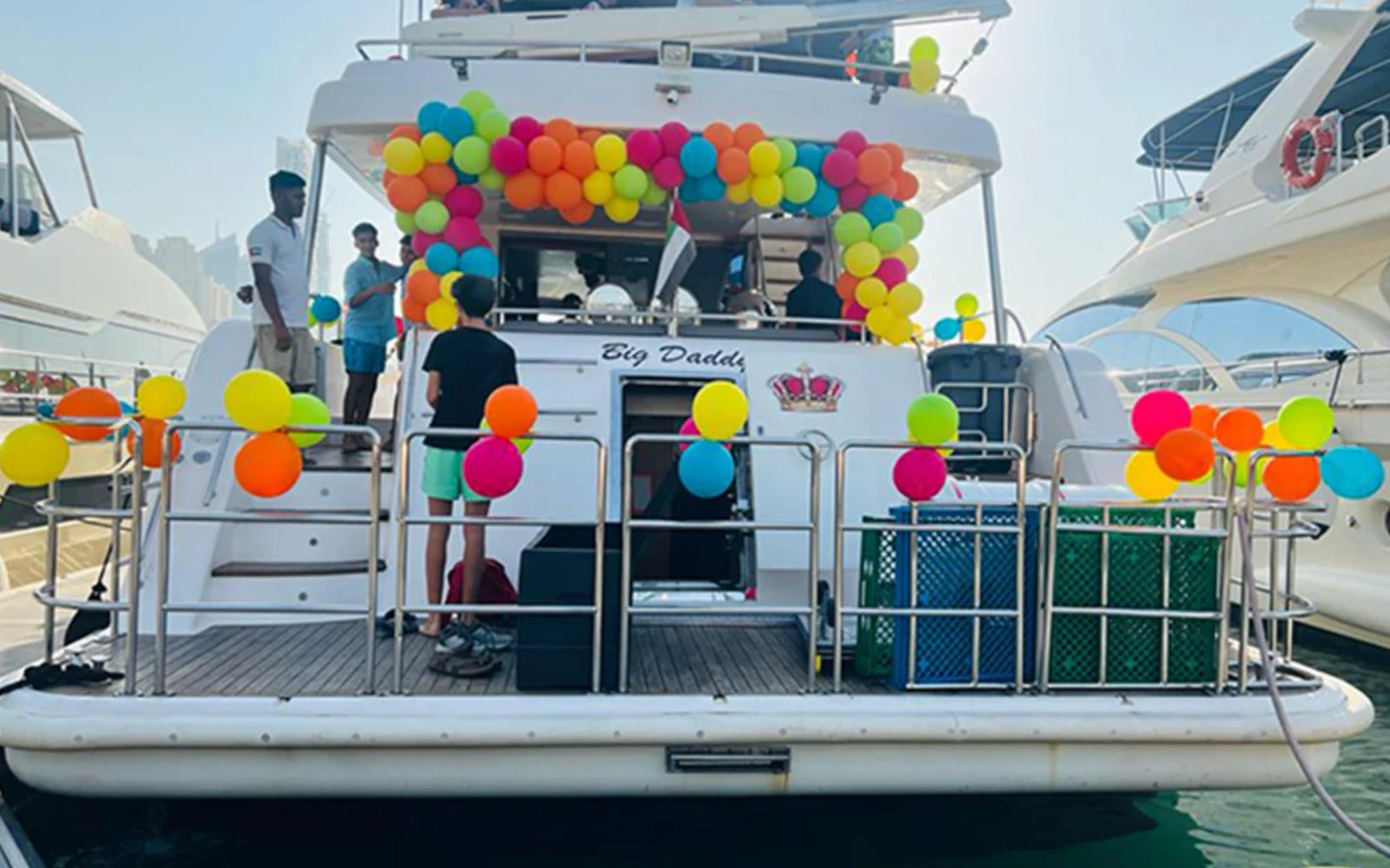 Yacht with colorful balloons on a clear day