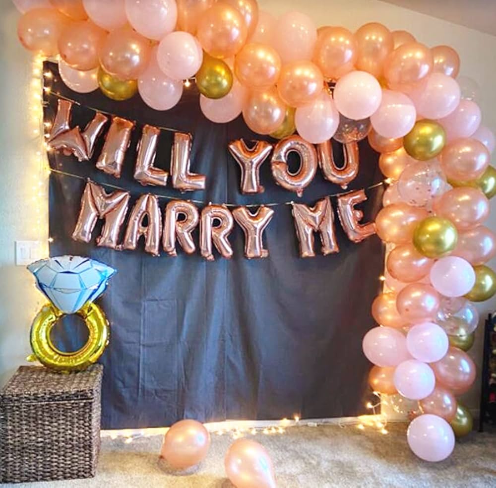 Rose gold marriage proposal decor