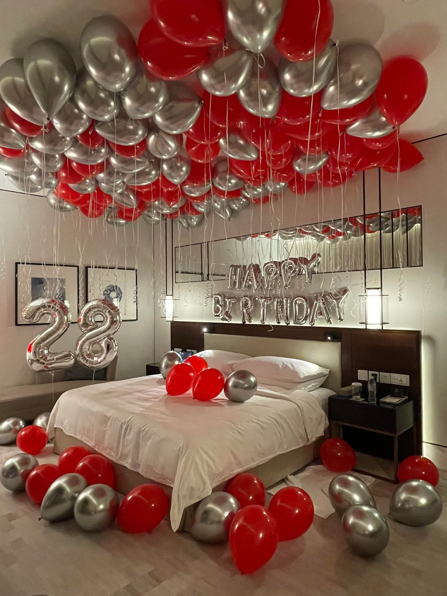 silver and red latex balloons in birthday room decoration in Dubai