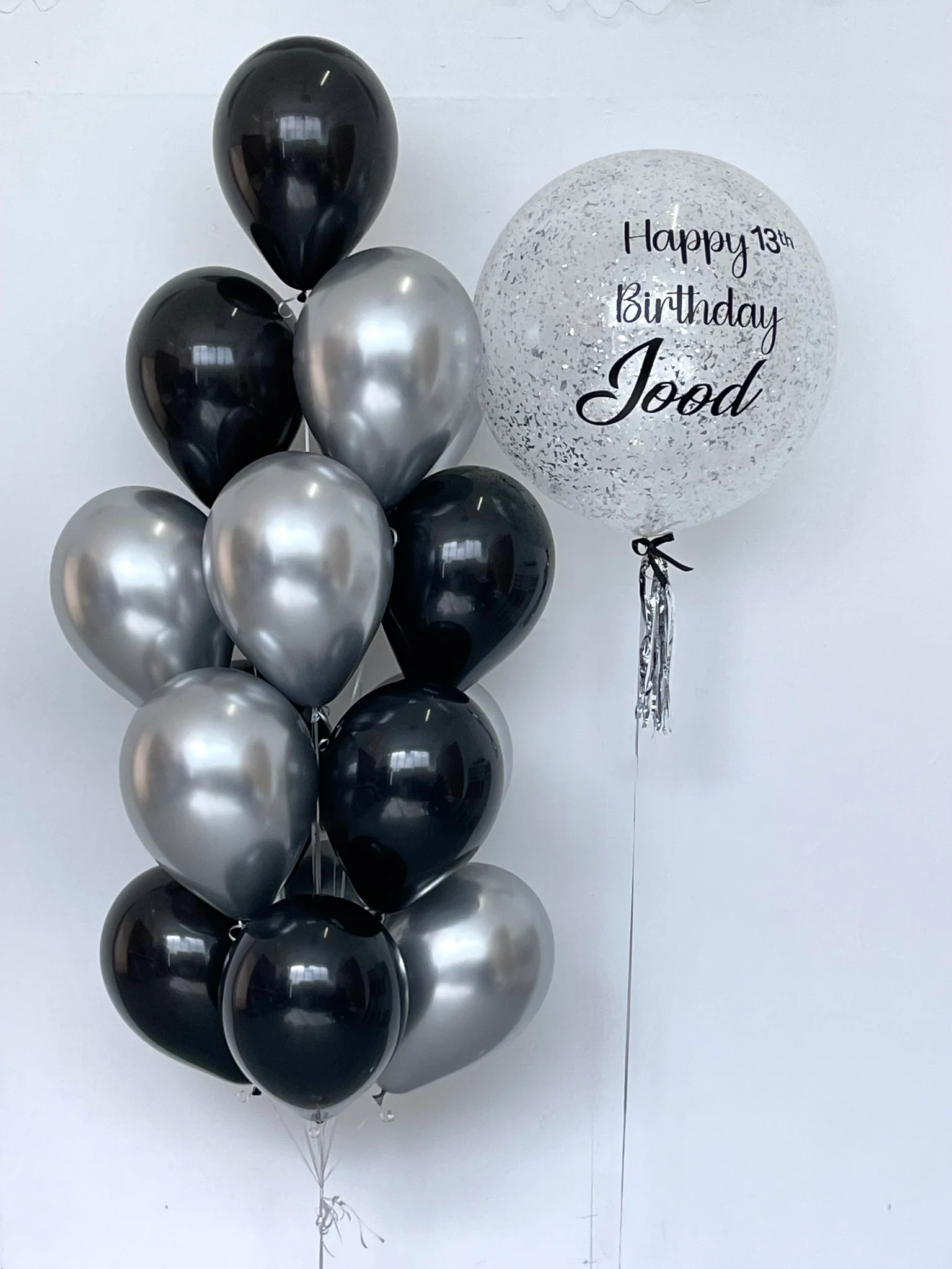 black and silver balloons bouquet in Dubai