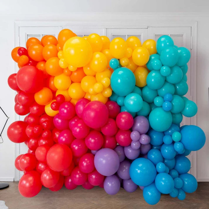 Colorful balloon arch in rainbow pattern for sale in Dubai