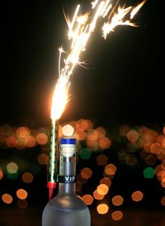 sparkling candles on top of champagne bottle in Dubai